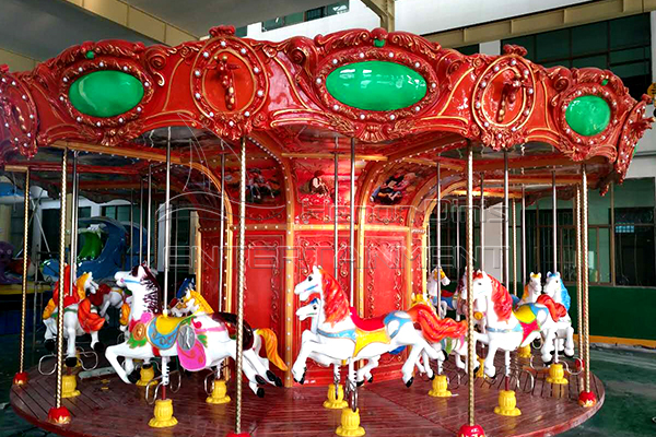 Old fashioned carousel rotating horses for sale